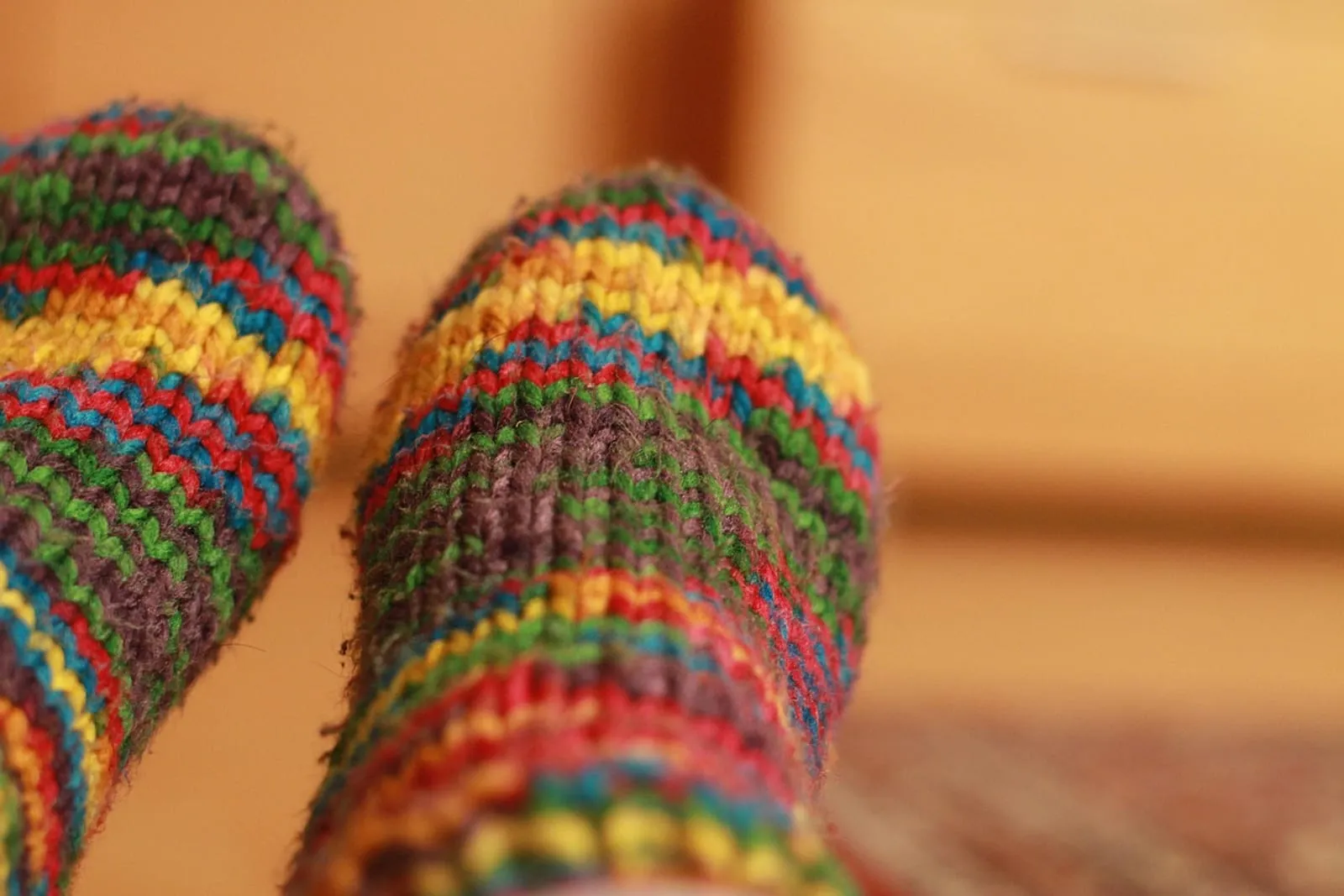 A pair of colorful knitted socks — all you need for sock curls