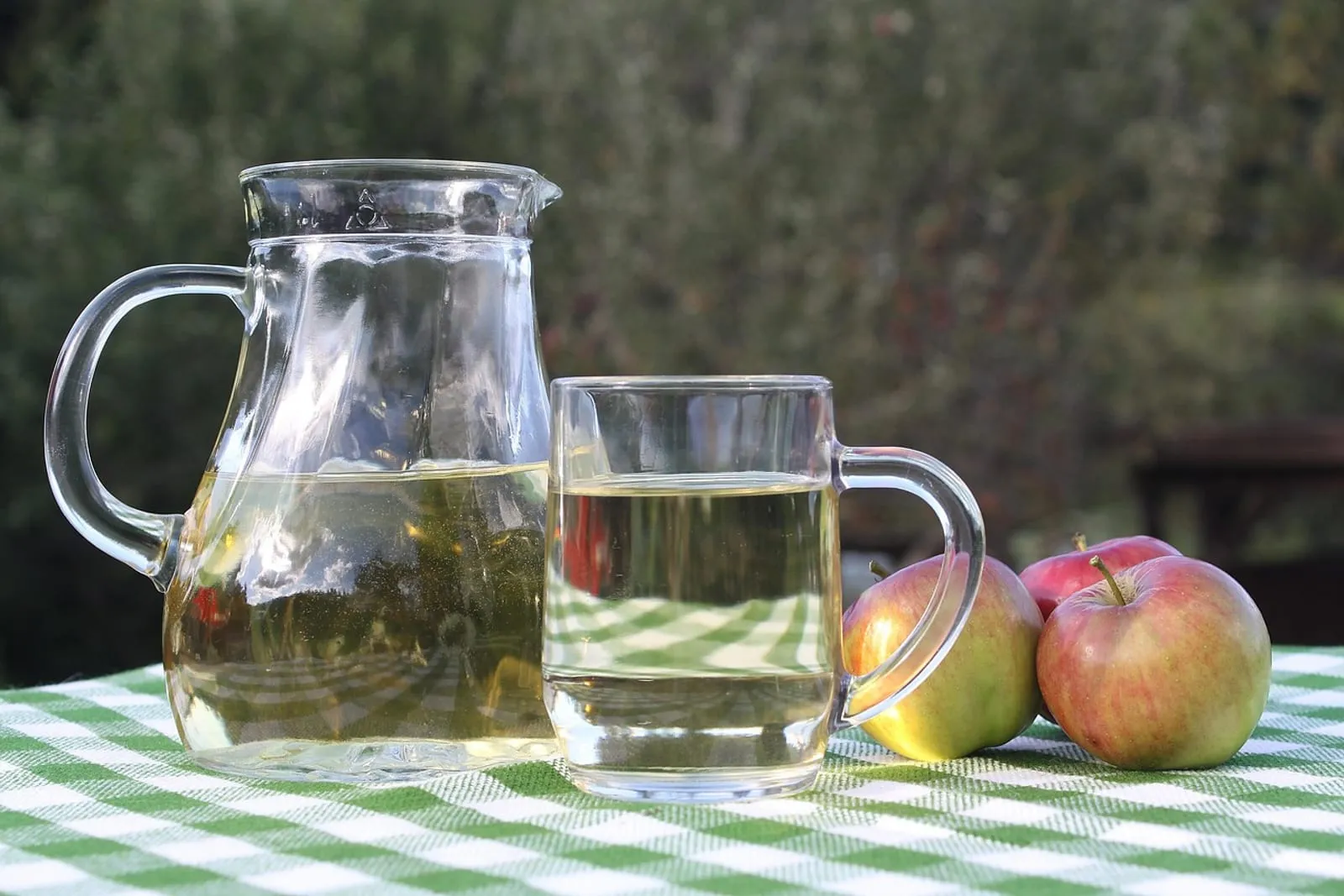 Glass of apple cider on a wooden table