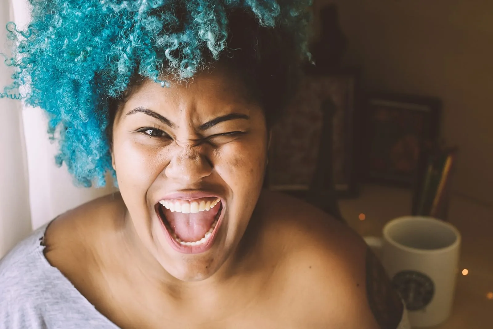 Smiling woman with defined curly hair