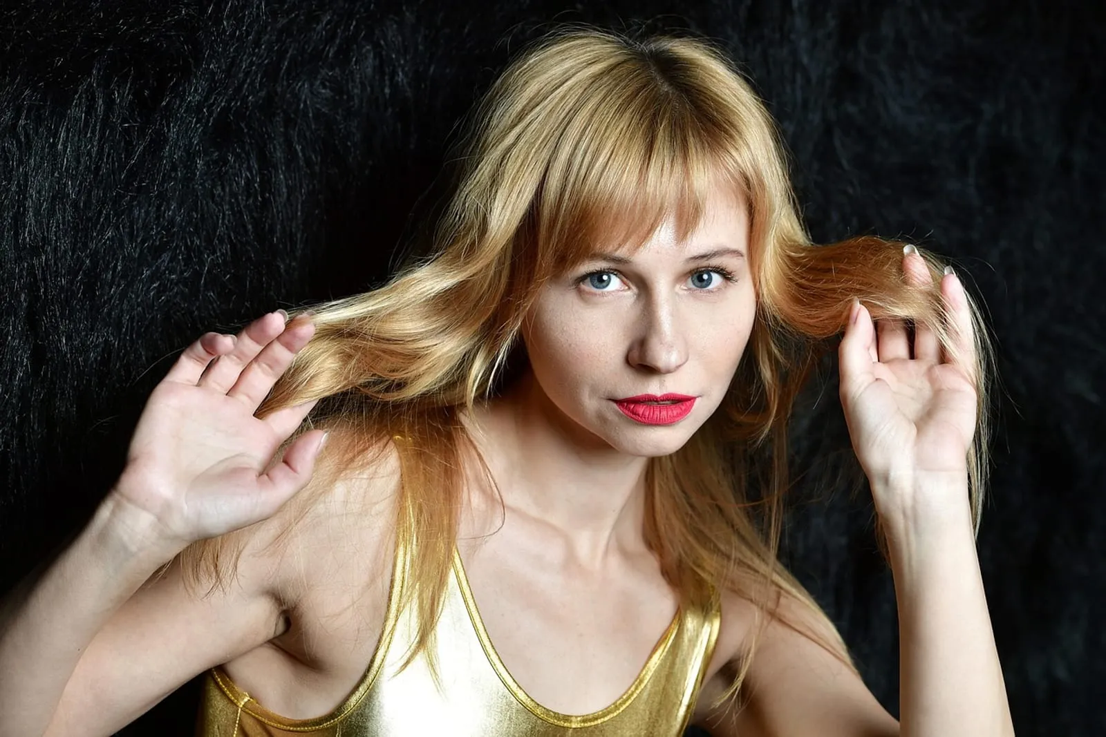 Blonde woman with soft wavy hair after a hair treatment