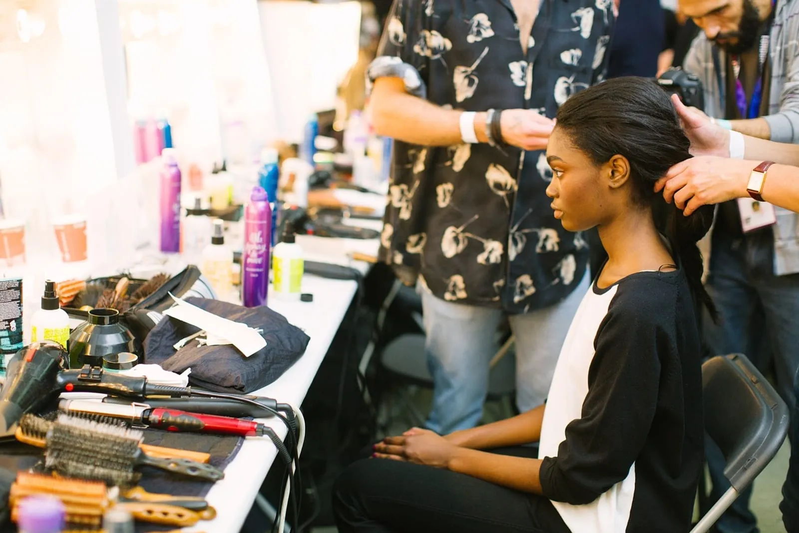 Woman in a salon chair with styled hair