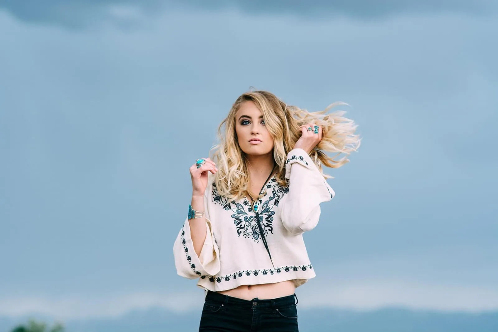Woman with soft blonde curls in natural light